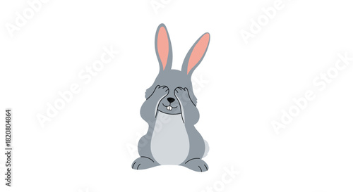 Adorable gray rabbit covering its eyes with its paws, playfully depicting shyness, peek-a-boo, or surprise.
