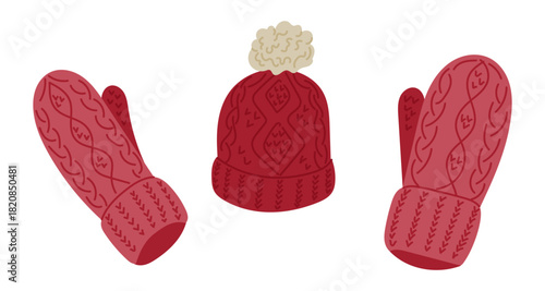 A warm knitted hat with matching mittens features cozy patterns in soft winter colors. The concept represents winter clothing, cold weather comfort and seasonal warmth
