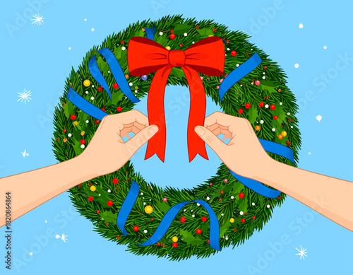 Hands adjusting a red bow on a festive Christmas wreath with blue ribbons, against a light blue background with snowflakes.