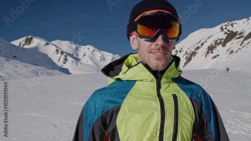 Wallpaper Mural Snow Sportsman: A resilient figure in the snowy embrace of the mountains, donning winter gear. Focused and poised, ready to conquer the slopes. Torontodigital.ca