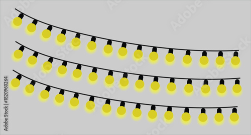 Three strings of yellow festive lights on a gray background