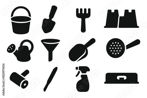 Sandcastle Tools Icons. Solid style icons of Sandcastle Tools: plastic bucket, hand spade, rake, mold set, watering can, funnel,