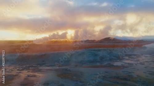 Wallpaper Mural Drone shot over Iceland’s Hverir geothermal fields, revealing dramatic steam vents, colorful sulfur textures, and raw volcanic energy in a surreal otherworldly landscape. Torontodigital.ca