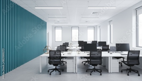 Interior view of a modern office space with desks chairs and a blue accent wall and bright lighting