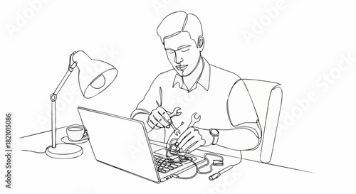 Man intently working on electronics with tools and laptop, focused.