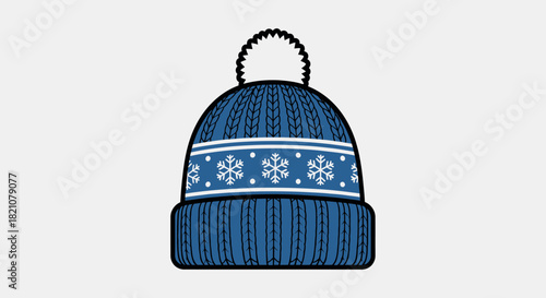 Blue knitted winter beanie hat with white pom pom and snowflake pattern