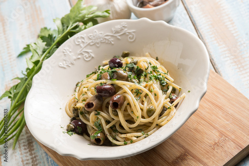 spaghetti with anchovy capers  black olives and parsley