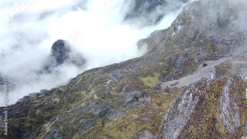 Aerial view of the Carstensz Pyramid, Papua. Mysterious clouds and atmosphere. The peak of the Carstensz Pyramid is the highest mountain in Indonesia and the seventh highest in Southeast Asia.