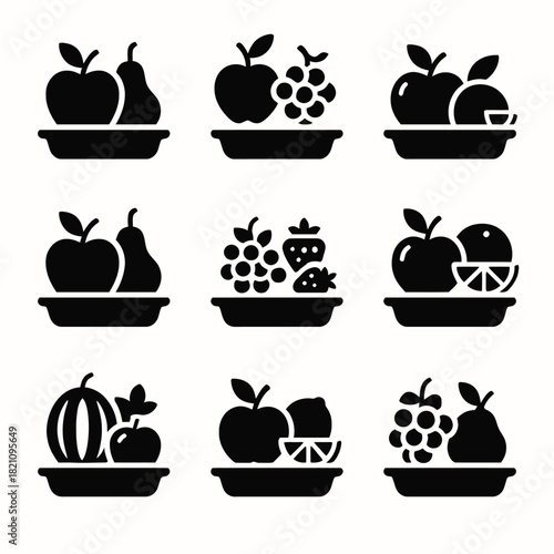 Set of nine fruit silhouettes in black and white on trays