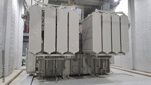 large power transformer in indoor substation with cooling radiators