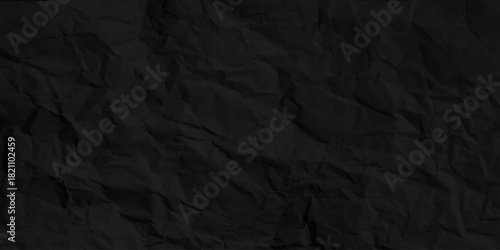 Black creased paper background texture