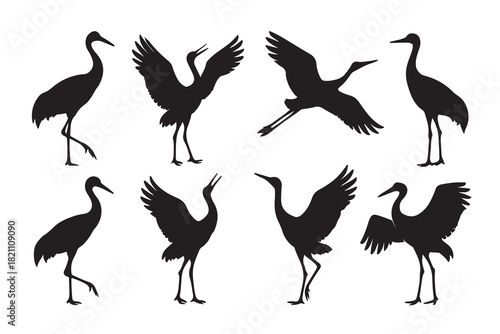 Silhouettes of cranes in various poses against a white background