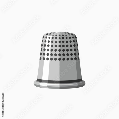 Close up view of a metallic thimble used for sewing protecting fingers when pushing a needle through fabric