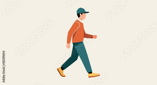 Man in casual attire walking forward with a cap on a light background.