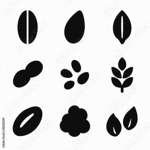 Set of nine black silhouette icons of seeds and plant elements
