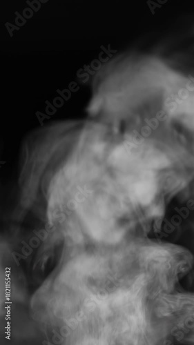 Vertical close up of white steam rising calmly like smoke, filling the frame, resembling steam from cooking pot, abstract clip for kitchen, food or magic themes, no people