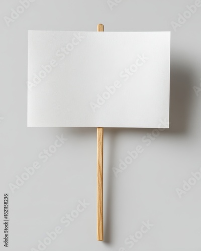 Empty White Sign on Wooden Stick, Ideal for Protests or Messages, Isolated Against Clean Background