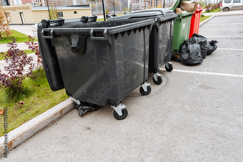 city garbage and recycling setup, urban garbage collection scene with tied bags and asphalt markings