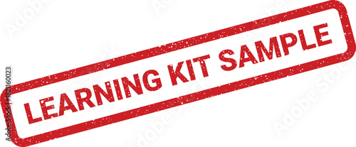 Distressed red rubber stamp with LEARNING KIT SAMPLE text signifying a component of an educational package