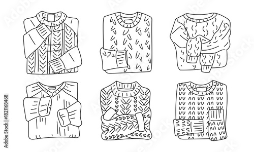 A set of contoured knitted sweaters in various models folded. Products with a variety of knitted textures. Cable knit and minimalist patterns. Insulated winter sweaters, monochrome gifts, top view