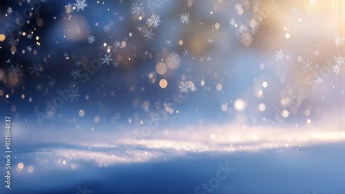 雪の結晶が静かに降り積もる幻想的な冬の青い背景とキラキラ輝く黄金色の光