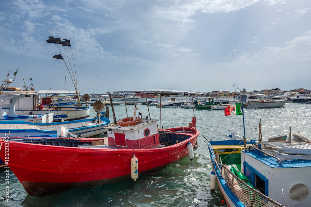 Fototapeta premium Boats in port of Marzamemi village on the island of Sicily, Italy