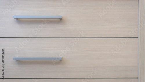 close-up of the texture and part of the cabinet with handles