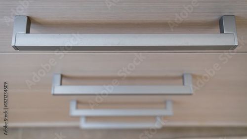 close-up of the texture and part of the cabinet with handles
