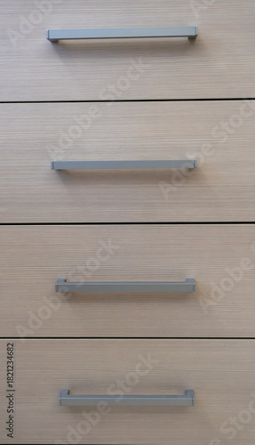 close-up of the texture and part of the cabinet with handles