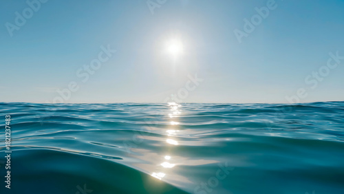 Fototapeta Naklejka Na Ścianę i Meble -  Sunlight reflecting on the ocean waves creating a beautiful and peaceful scene on a bright sunny day