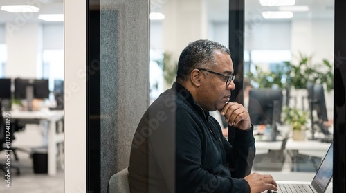 An office scene featuring a...