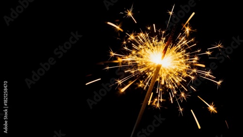 Wallpaper Mural A bright sparkling sparkler with golden sparks on a dark background. Symbol of New Year's Eve celebration, party, and fun night. Torontodigital.ca
