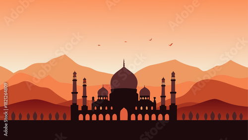 Silhouette of mosque with mountains in background