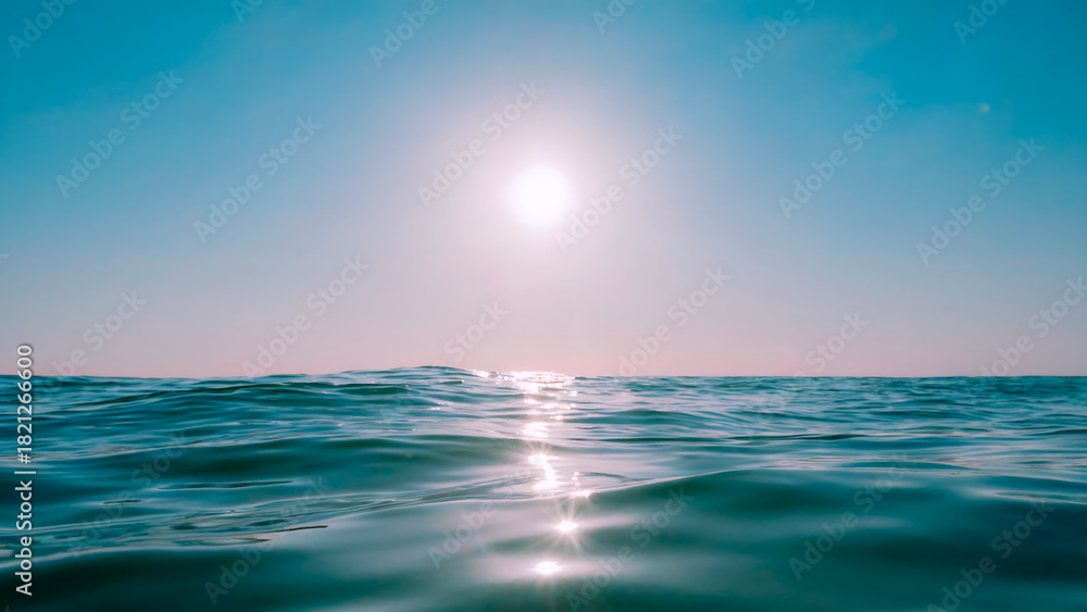 Fototapeta premium Sunlight reflecting on the ocean waves creating a beautiful and peaceful scene on a sunny day