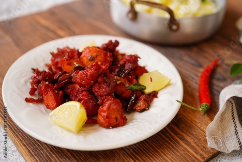 Homemade Chicken 65 - Popular Indian bar ppetizer  served with saffron rice