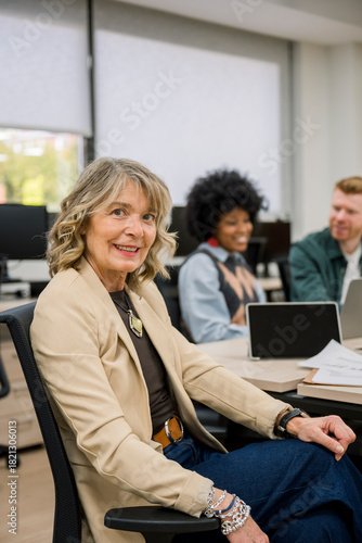 Senior businesswoman smiling at office meeting table