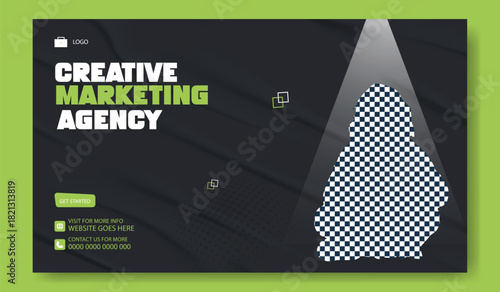 Young woman holding a notebook illuminated by a spotlight in a modern creative marketing agency office space