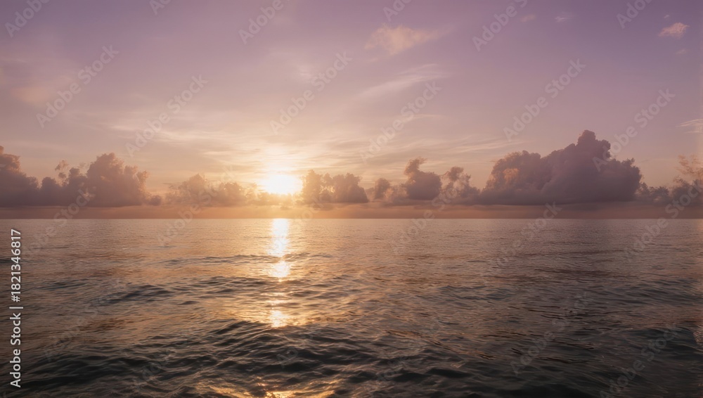 Naklejka premium Sunrise over the water with a beautiful golden glow and reflection.