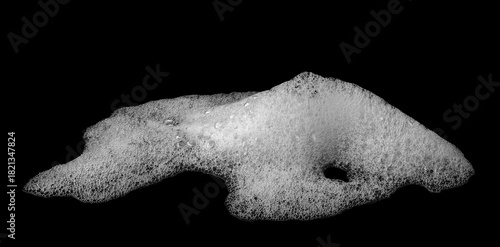 white foam soap isolated on a black background. concept of shampoo bubble, suds texture bathtub. shaving cream gel, bath lather. foam bubble	

