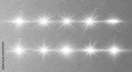 Collection of bright white lens flare effects on a transparent background for design