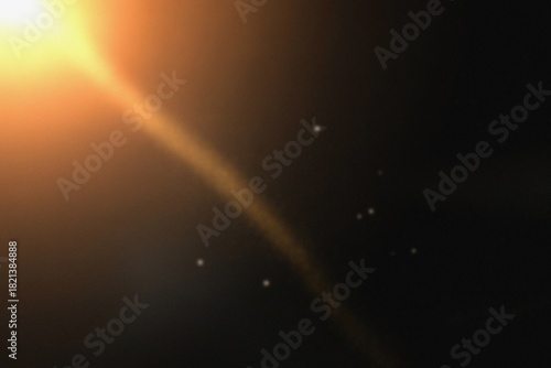 Foto Golden sunlight creating a dynamic lens flare across a dark backdrop