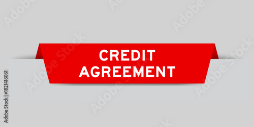 Red color inserted label with word credit agreement  on gray background