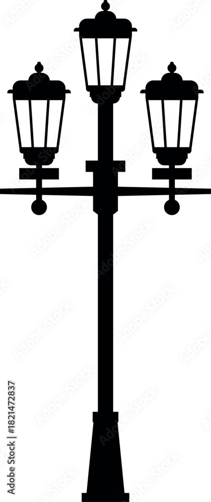 Fototapeta premium A black and white image of a street light pole with three lights on it