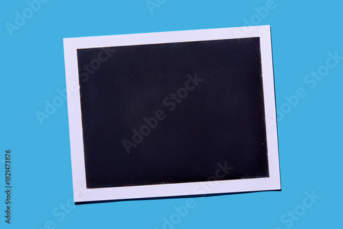 Blank Polaroid on blue background