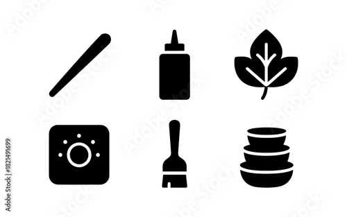 Essential kitchen tools and ingredients icons in simple black silhouettes