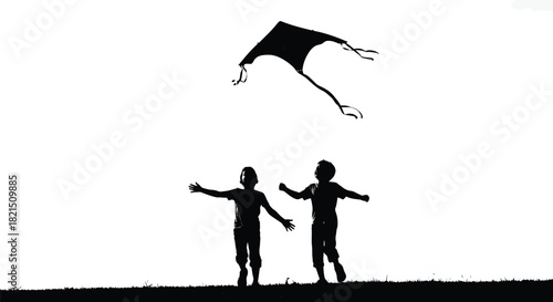 Children flying a kite in silhouette Keywords: childhood, fun, freedom, kite, flying, playing