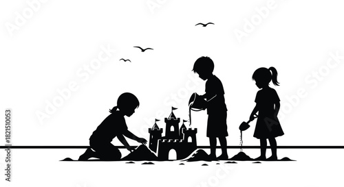 Children Silhouettes Building a Sandcastle on a Beach