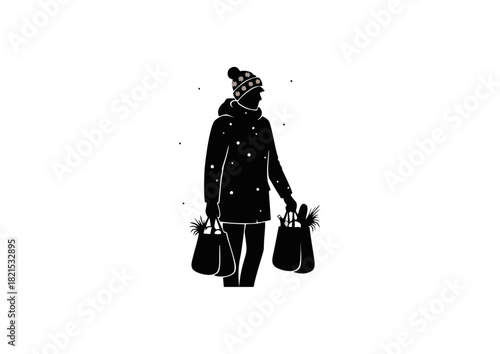 Black and white silhouette of a woman in a winter hat and coat carrying shopping bags filled with gifts and greenery