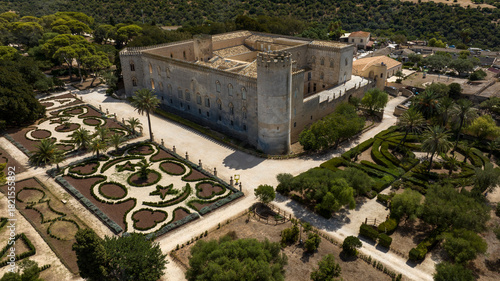 Aerial view of Donnafugata Castle, located in the province of Ragusa, Sicily, Italy. It is a very large building in Neo-Classical and Neo-Gothic style with a beautiful ornamental garden.