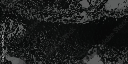 Abstract dark and moody background with organic, flowing shapes and a high-contrast, almost liquid-like texture in shades of black and dark grey, evoking a sense of mystery